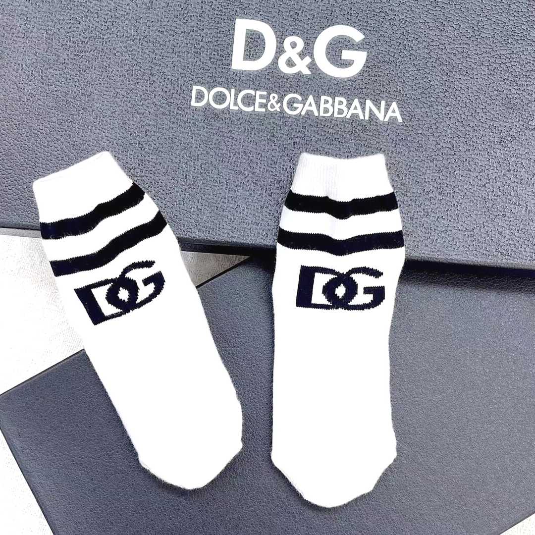 White Dolce and Gabbana Socks with black text logo and black lines