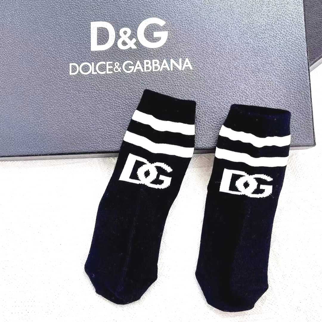 Black Dolce and Gabbana Socks with white text logo and white lines